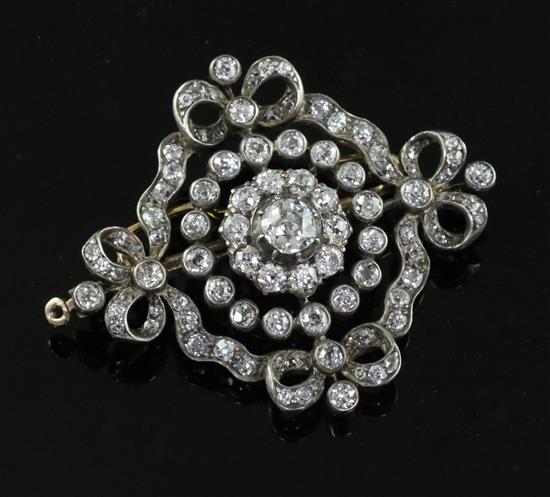 A Victorian, gold, silver and old mine cut diamond set pendant brooch, 48mm.